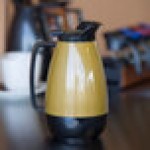 Service Ideas Thermo-Serv 20 oz. Gold ABS Plastic Insulated Coffee Carafe / Server with Flip-Top Lid TS501KB