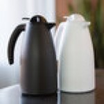 Service Ideas Alpha Carafe 33.8 oz. White Plastic Insulated Coffee Carafe / Server with Push-Button Lid ALPH10WH