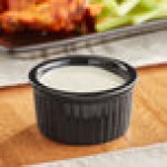 Acopa 2.5 oz. Glossy Black Fluted Stoneware Ramekin - 12/Pack