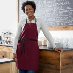 Choice Burgundy Poly-Cotton Adjustable Bib Apron with 2 Pockets and Black Webbing Accents - 32 Choice Burgundy Poly-Cotton Adjustable Bib Apron with 2 Pockets and Black Webbing Accents - 32
