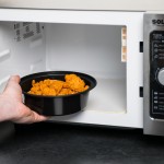 Pactiv Newspring NC729B 32 oz. Black VERSAtainer Round Microwavable Container with Lid - 150/Case