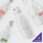 Acopa 19 oz. Customizable Clear Glass Bottle with Wire Bail Swing Top Lid - 12/Case