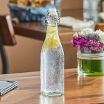 Acopa 19 oz. Customizable Clear Glass Bottle with Wire Bail Swing Top Lid - 12/Case
