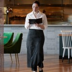 Choice Black and White Pinstripe Poly-Cotton Standard Bistro Apron with 1 Pocket - 33
