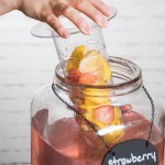 Acopa 2 Gallon Mason Jar Glass Beverage Dispenser with Infusion Chamber, Chalkboard Sign, and Metal Stand