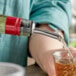 TableCraft Stainless Steel Free Flow Liquor Pourer with Hinged Cap 320C - 60/Case