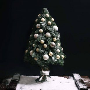 Christmas tree made of pine needles Gold