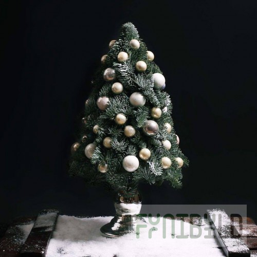 Christmas tree made of pine needles Gold