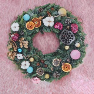 Decorative wreath made of spruce branches Santa