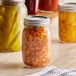 Choice 16 oz. Pint Regular Mouth Glass Canning / Mason Jar with Silver Metal Lid and Band - 12/Case Choice 16 oz. Pint Regular Mouth Glass Canning / Mason Jar with Silver Metal Lid and Band - 12/Case