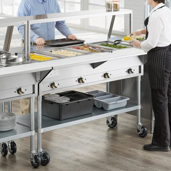 ServIt Four Pan Open Well Electric Steam Table with Angled Sneeze Guard, Fixed Tray Slide, and Casters - 208/240V, 3000W ServIt Four Pan Open Well Electric Steam Table with Angled Sneeze Guard, Fixed Tray Slide, and Casters - 208/240V, 3000W