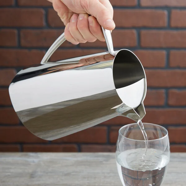 Vollrath 46206 Triennium 73.6 oz. Mirror-Finished Stainless Steel Water Pitcher with Ice Guard
