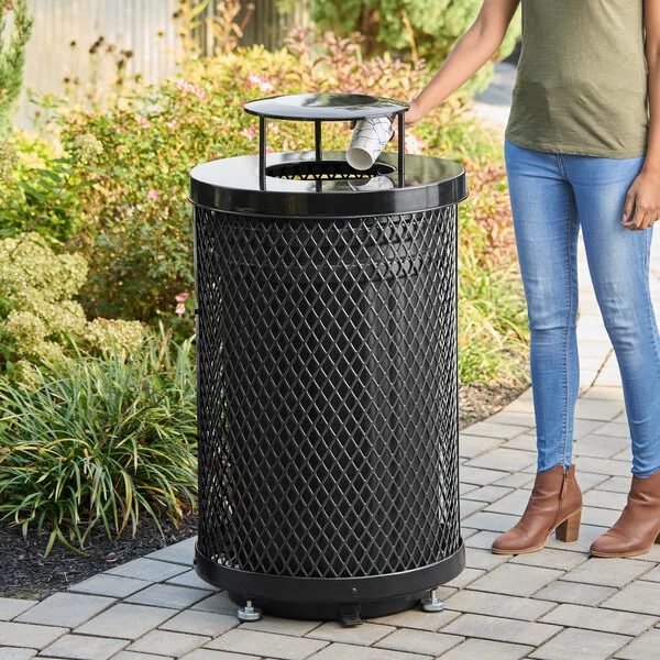 Lancaster Table & Seating 36 Gallon Heavy-Duty Round Black Expanded Steel Outdoor Trash Can with Rain Bonnet Lid Lancaster Table & Seating 36 Gallon Heavy-Duty Round Black Expanded Steel Outdoor Trash Can with Rain Bonnet Lid