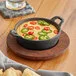 Valor 12 oz. Pre-Seasoned Mini Cast Iron Round Serving Bowl with Rustic Chestnut Finish Rubberwood Underliner Valor 12 oz. Pre-Seasoned Mini Cast Iron Round Serving Bowl with Rustic Chestnut Finish Rubberwood Underliner