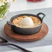 Valor 12 oz. Pre-Seasoned Mini Cast Iron Round Serving Bowl with Rustic Chestnut Finish Rubberwood Underliner Valor 12 oz. Pre-Seasoned Mini Cast Iron Round Serving Bowl with Rustic Chestnut Finish Rubberwood Underliner