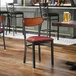 Lancaster Table & Seating Boomerang Black Finish Chair with Burgundy Vinyl Seat and Antique Walnut Wood Back - Unassembled Lancaster Table & Seating Boomerang Black Finish Chair with Burgundy Vinyl Seat and Antique Walnut Wood Back - Unassembled