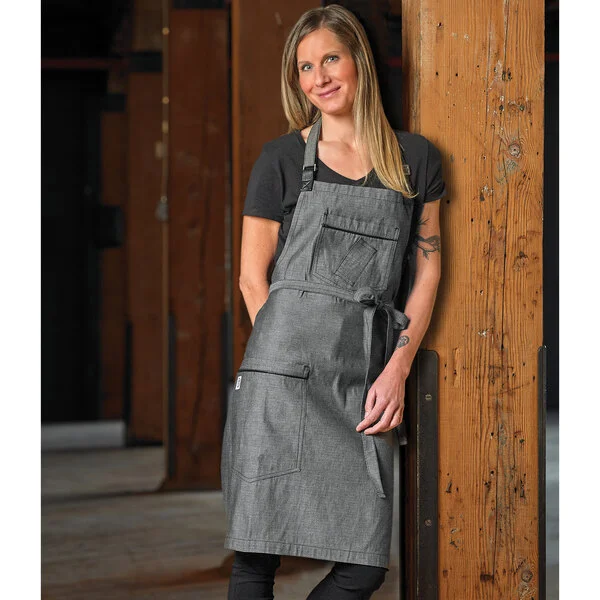 Mercer Culinary M63200BKD Metro Edge Flannery Black Dobby Denim Bib Apron with Adjustable Neck, Leather Towel Holder, and 3 Pockets - 34 1/4