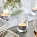 Acopa 2 oz. Clear Round Glass Votive / Tealight Holder - 12/Case Acopa 2 oz. Clear Round Glass Votive / Tealight Holder - 12/Case