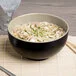 Elite Global Solutions JW542T Karma 1.5 Qt. Ebony and Sand Round Two-Tone Melamine Bowl - 6/Case Elite Global Solutions JW542T Karma 1.5 Qt. Ebony and Sand Round Two-Tone Melamine Bowl - 6/Case