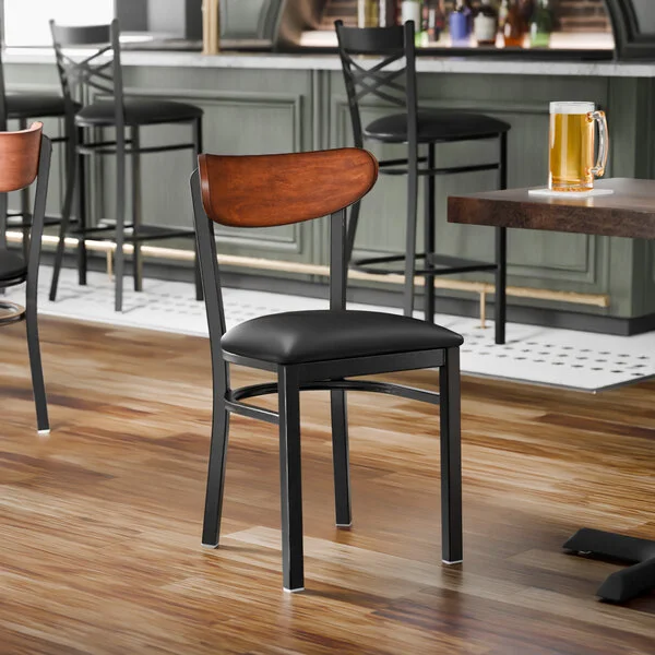 Lancaster Table & Seating Boomerang Black Finish Chair with Black Vinyl Seat and Antique Walnut Wood Back - Unassembled Lancaster Table & Seating Boomerang Black Finish Chair with Black Vinyl Seat and Antique Walnut Wood Back - Unassembled