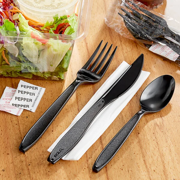 Solo Impress Heavy Weight Black Wrapped Plastic Cutlery Set with Napkin and Salt / Pepper Packets - 250/Case Solo Impress Heavy Weight Black Wrapped Plastic Cutlery Set with Napkin and Salt / Pepper Packets - 250/Case
